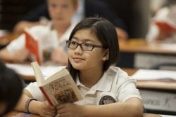 A student listens to an instructor while remembering a story