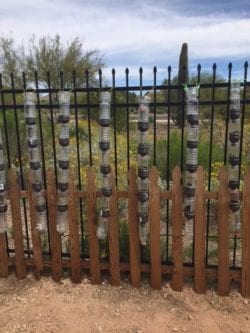 Stacked plastic water bottles, possibly for catching rain