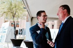 Faculty members laughing together