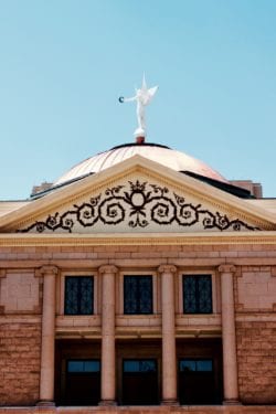 A building with a statue on top