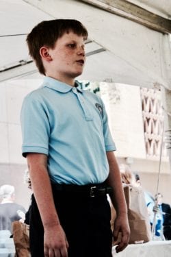 A young person standing at a store