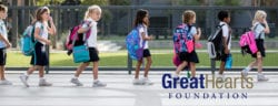 Students walking in a line with their backpacks