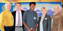 Five members of the Rotary Club of Scottsdale pose together