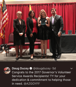 Doug Ducey receiving an award