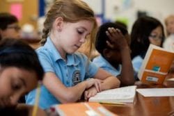 student studying in a charter school classroom