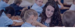 Great Hearts teacher sitting with a student