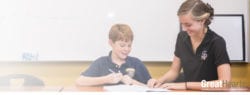 boy and teacher in classroom