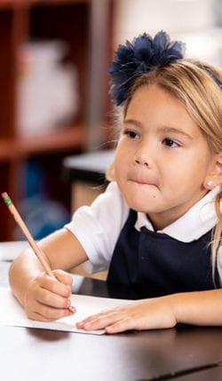 A young girl studying for a classical education.