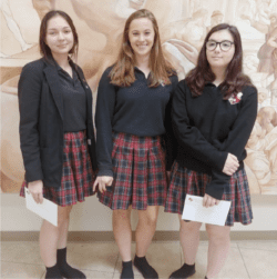 3 girls standing in school hallway