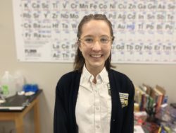 Audrey Beermann in front of periodic table