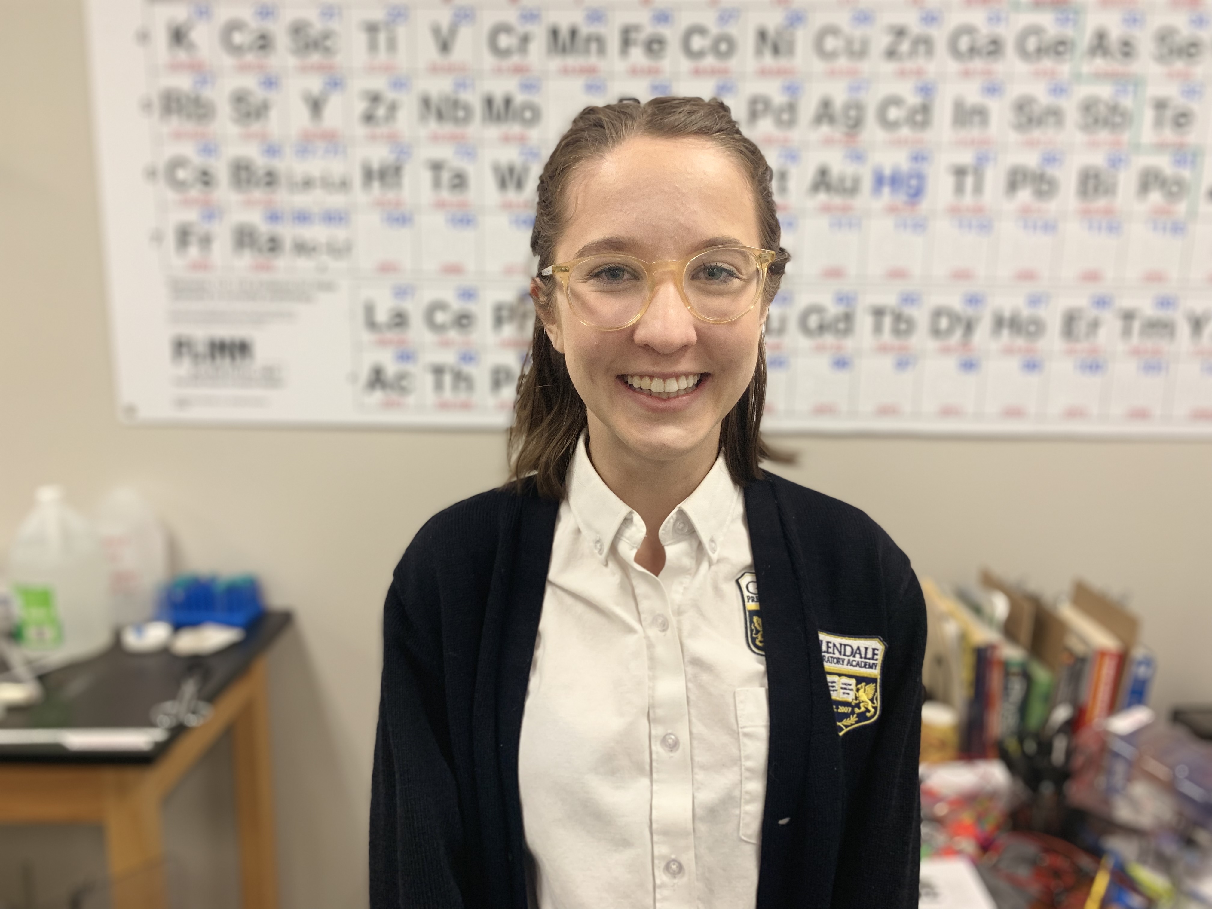Audrey Beermann in front of periodic table