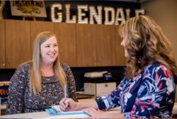 two femals teachers at desk