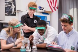 high school students doing a science experiment