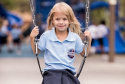 young girl on swing