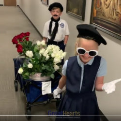 students giving flowers to teachers