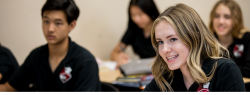 girl smiling at desk