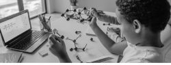 boy at desk doing science