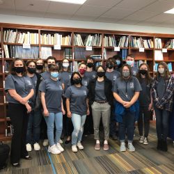 students standing in library