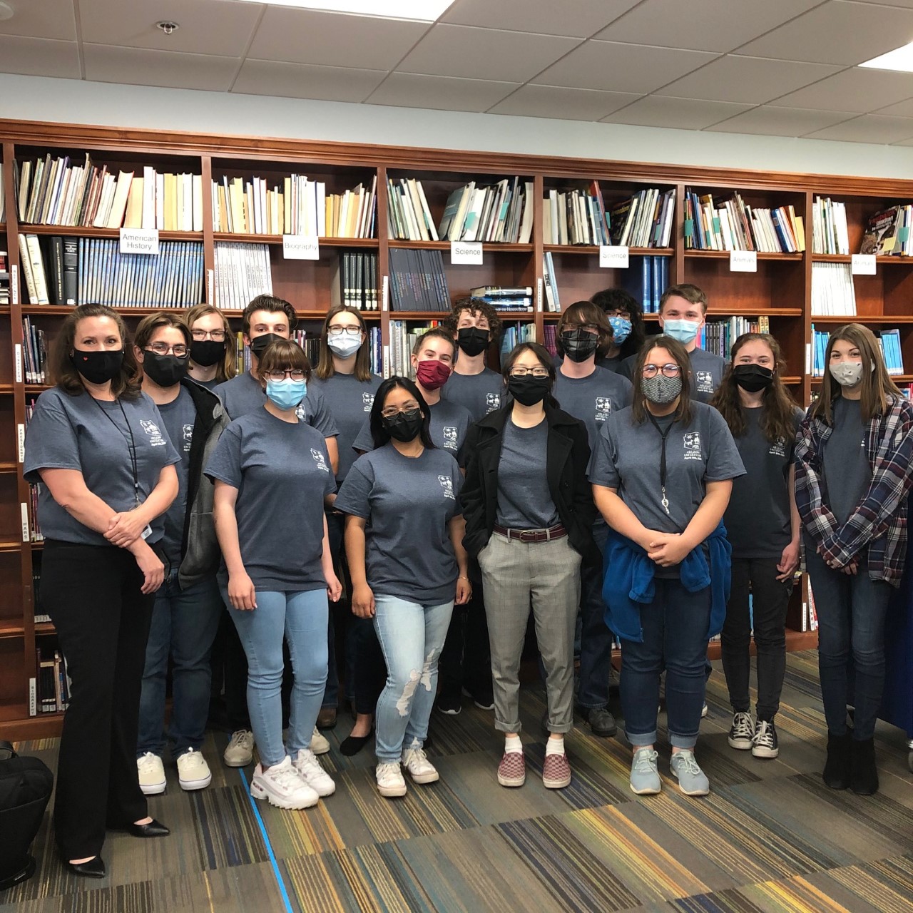 students standing in library