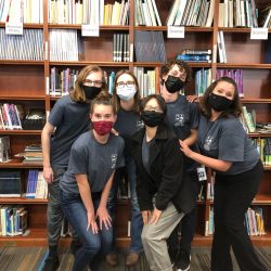 students standing in library