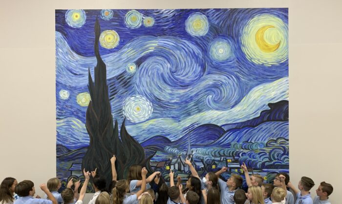 Students enjoying The Starry Night mural