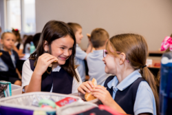 2 students laughing