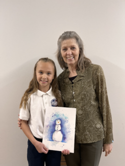 Student with her art teacher and artwork