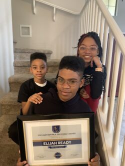 Elijah Ready and siblings with his award