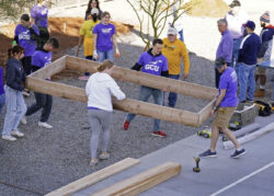 Volunteers helping build a school garden at Maryvale Prep
