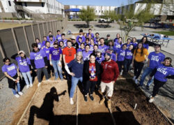 Volunteers helping build a school garden at Maryvale Prep