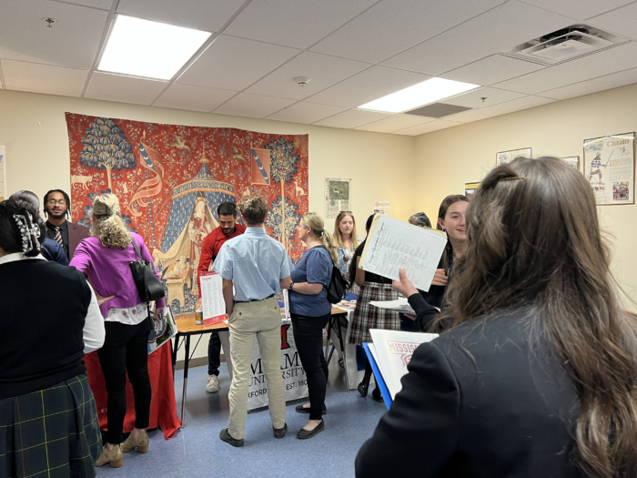 Students and Parents at College Symposium