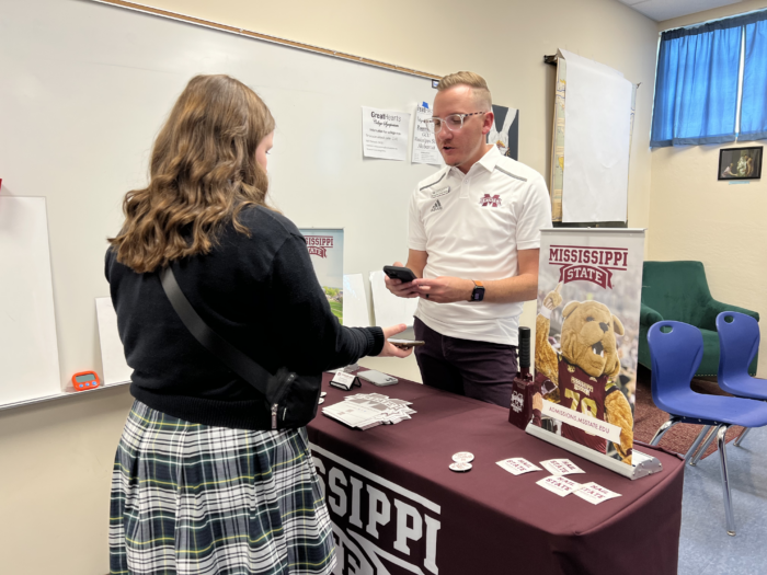 Student meeting with Representative at College Symposium.