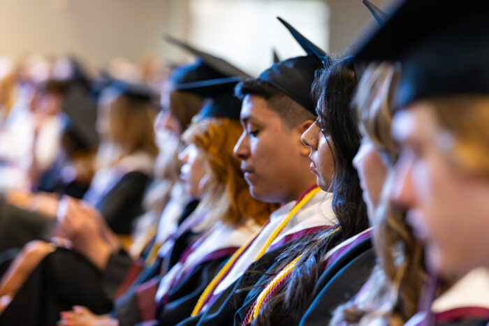 Graduates sitting in a row