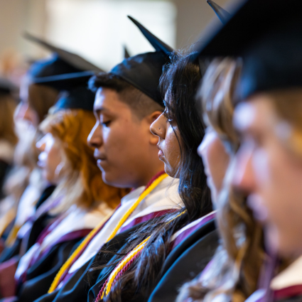 Graduates sitting in a row