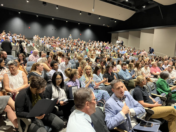 Auditorium filled with attendees at Great Hearts New Faculty Orientation (NFO).