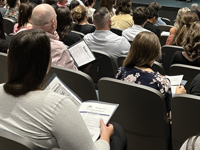 Auditorium filled with attendees at Great Hearts New Faculty Orientation (NFO).