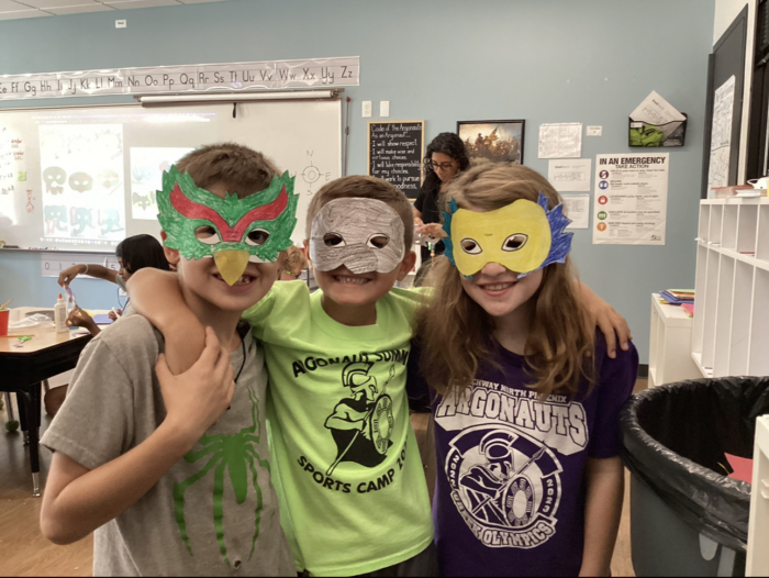 3 Summer Camp students wearing masks they had made