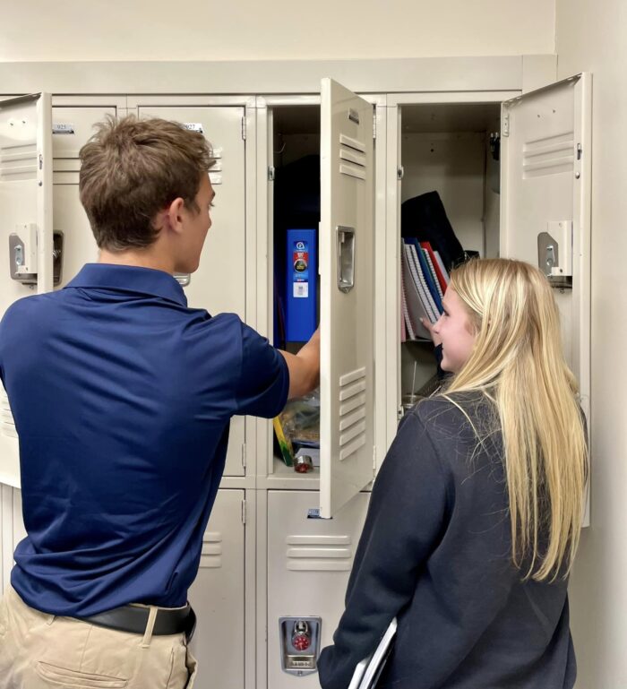 Two students at their lockers on the first day of school