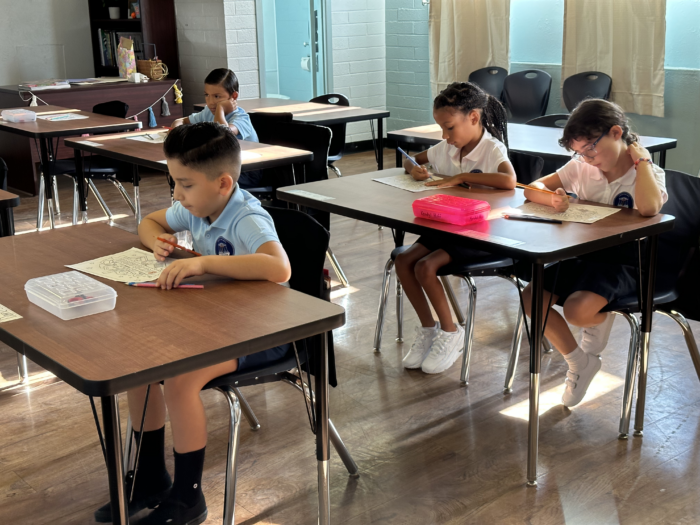students at their desks on the first day of school