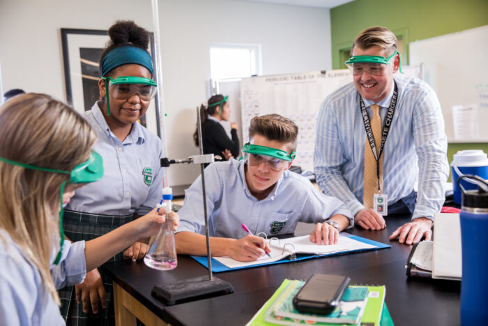High school students in a science class doing an experiment