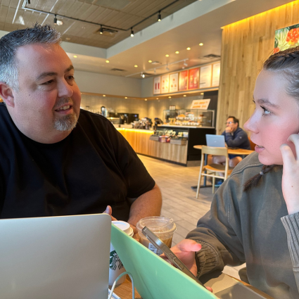 Father and high school senior at a coffee shop