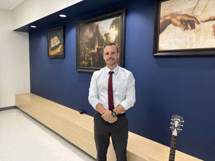 Stuart Coles, music teacher at Great Hearts Harveston, in hallway.