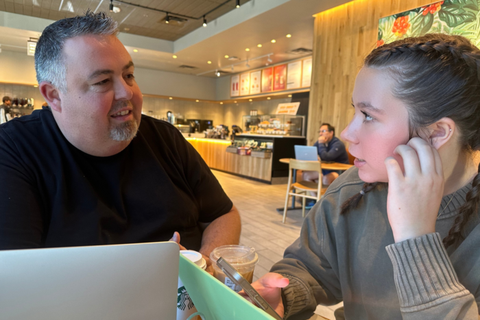 Father and high school senior at a coffee shop