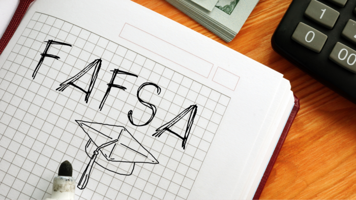 Notebook with FAFSA handwritten on it