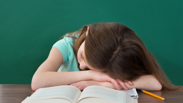 girl falling asleep at desk