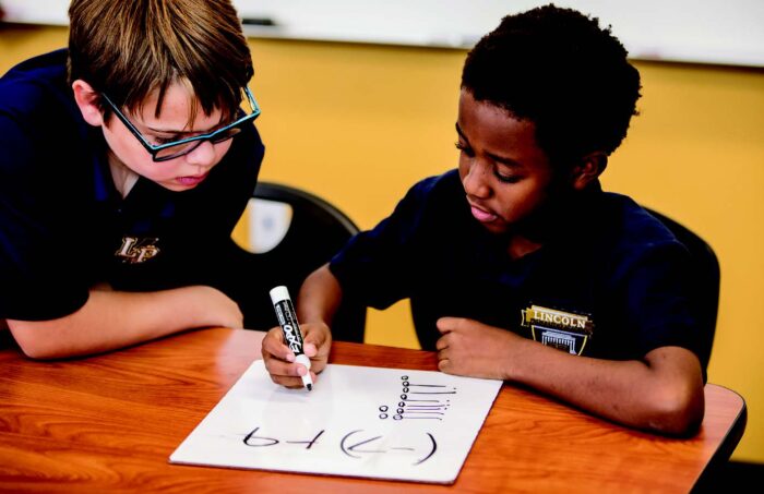 Students doing math problems together