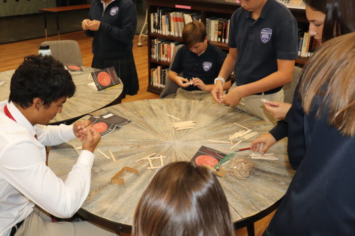 veritas students building a bridge at symposium
