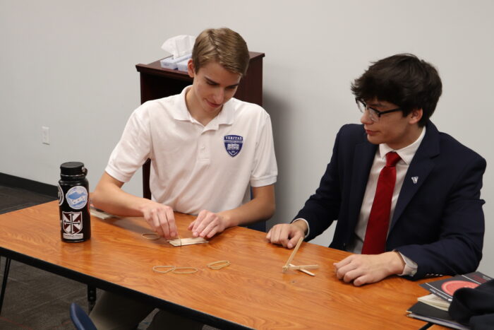 veritas students building a bridge at symposium