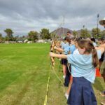 Students doing archery during Robin Hood Day