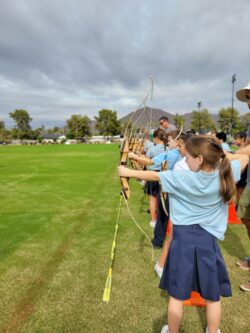 Students doing archery during Robin Hood Day
